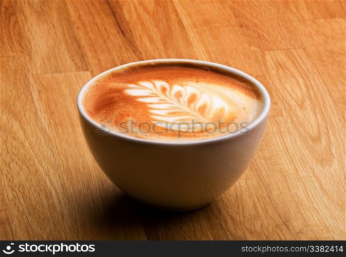 A latte in a bowl with latte art