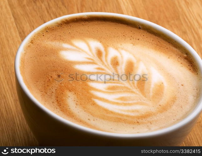 A latte in a bowl with latte art