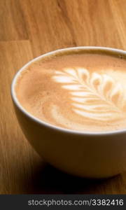 A latte in a bowl with latte art