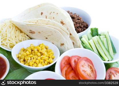 A layout of taco ingredients isolated on white