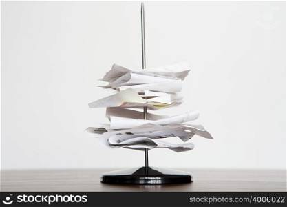 A letter spike with paper on it