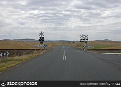 A level crossing on a dull, cloudy day in North-Western Victoria, Australia
