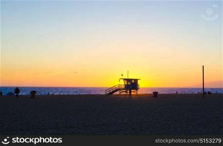 A lifeguard station on Santa Monica beach at sunset