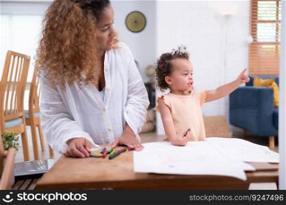 A little child’s imagination is represented through colored pencil drawings, with the mother attentively supervising in the living room of the house.