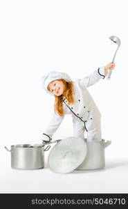 A little pretty girl dressed as a kitchen hand in a cooking pot holding a top and a ladle.