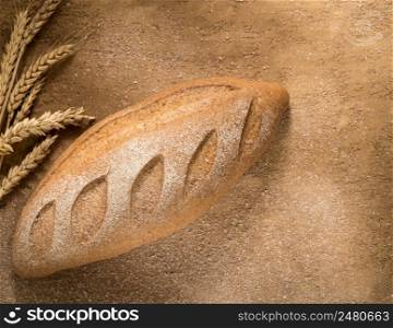 a loaf of bread with spikes on the plastered surface, top view. loaf of bread top view