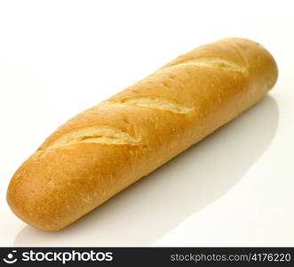 A loaf of fresh baked french or italian bread on a white background