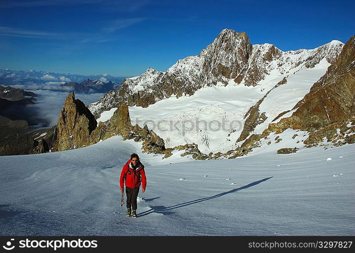 A lonely mountaineer on the south face of Mont Blanc, Italy.