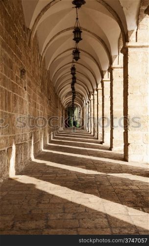 A long corridor on the top of the Temple Mount in the Old City of Jerusalem in Israel leads to the Chain Gate.