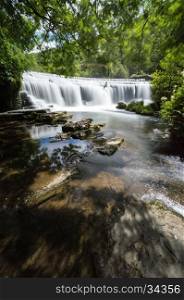 a long exposure at Monsal Dale Weir, at the River Wye, in the Peak District, Derbyshire