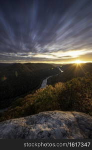 A long exposure of the morning cloud movement over the New River Gorge on a mid-October Fall morning just as the sun was cresting the mountains.