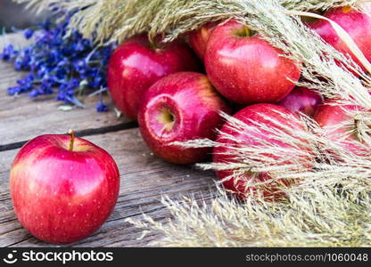 A lot of apples on a wooden table. Vitamins and a healthy diet. Vegetarian concept. Close-up.. A lot of apples on a wooden table. Vitamins and a healthy diet. Vegetarian concept.