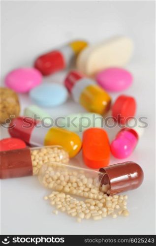 A lot of colorful pills from above