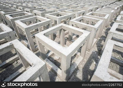 A lot of concrete square shape. Low quality precast box concrete on open space. Constructing an artificial reef using concrete blocks. Background, Texture. Bright sunlight. Thailand.