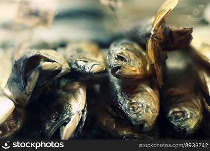 a lot of dried fish as an appetizer for beer