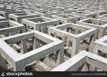 A lot of low quality precast concrete box on open space, concrete blocks or concrete square-shape. High angle view.