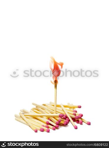 A lot of matches on white isolated background. A match is lit.