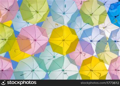A lot of multicolored umbrellas. Color umbrellas urban decoration. . Multicolored Umbrella decorations.