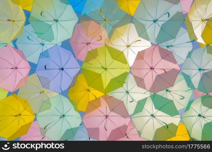 A lot of multicolored umbrellas. Color umbrellas urban decoration. . Multicolored Umbrella decorations.