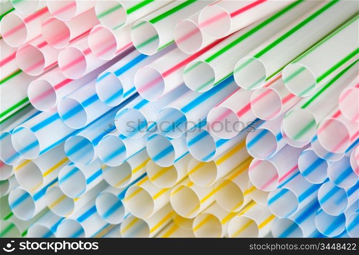 A lot of plastic colourful drinking straws