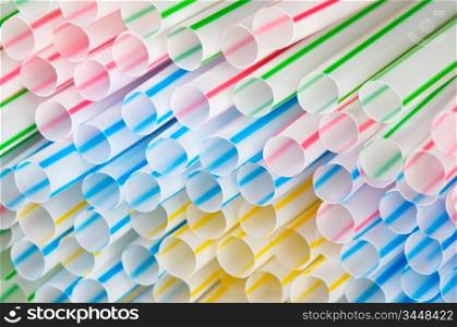 A lot of plastic colourful drinking straws