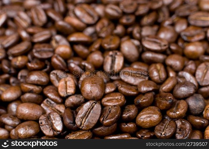 a lot of roasted coffee beans as a background
