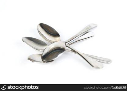 a lot of spoons isolated on white