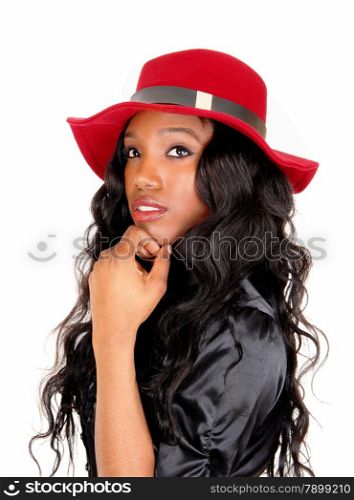 A lovely African American woman in a black blouse and long black curlyhair with a red hat, isolated for white background.
