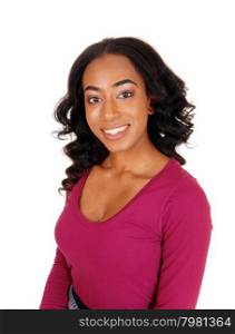 A lovely African American woman with long curly black hair smilingin a portrait image, isolated for white background.