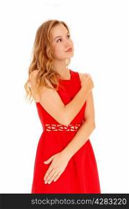 A lovely beautiful young woman standing in a red dress, looking upisolated for white background.