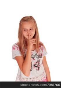 A lovely blond young girl standing for white background holding herfinger over her mouth, don&rsquo;t talk.