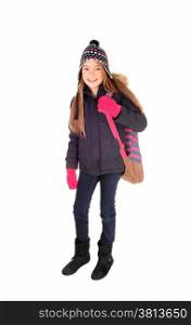 A lovely eight year old girl with long blond hair, a hat and mittens with herbackpack over her shoulder, isolated on white background.