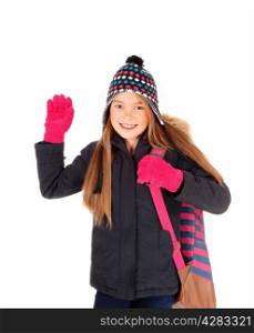 A lovely eight year old girl with long blond hair, a hat and mittens waivinggood by, isolated on white background.