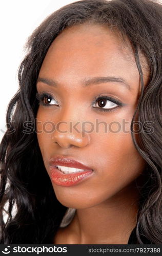 A lovely face of a African American woman standingin the studio, isolated for white background.