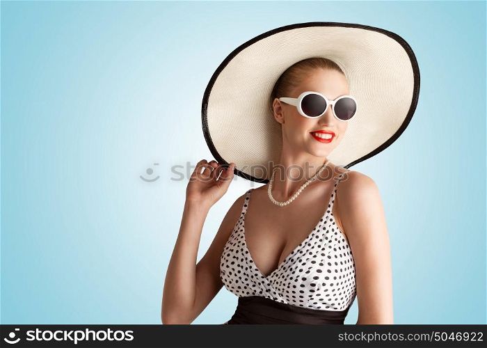 A lovely photo of pin-up girl in vintage hat.
