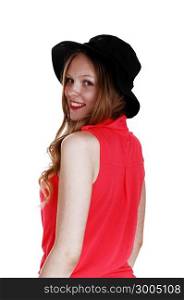 A lovely teen girl standing in a pink blouse and black hat from the back,isolated for white background.