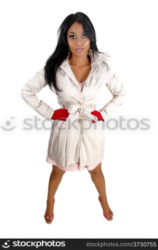 A lovely young Asian woman in a white coat and red mittens standingfor white background.