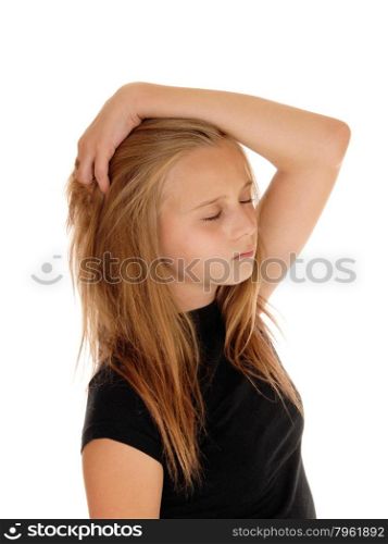 A lovely young pretty girl standing with one hand on her head and hereye&rsquo;s closed, isolated for white background.