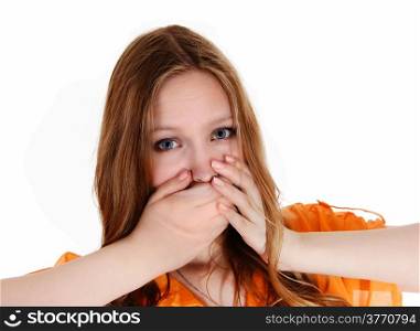 A lovely young woman holding her hands over her mouth, did say thewrong thing, isolated for white background.