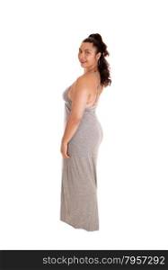 A lovely young woman standing in profile in a gray dress, isolatedfor white background, in full body length.