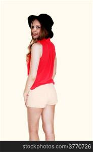 A lovely young woman standing in shorts and hat from the back,isolated for white background.