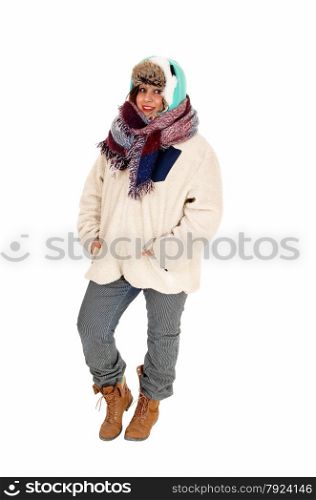 A lovely young woman with a big scarf around her neck and head,dressed for very cold weather, isolated for white background.
