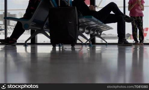 A low angle of passengers waiting in an airport
