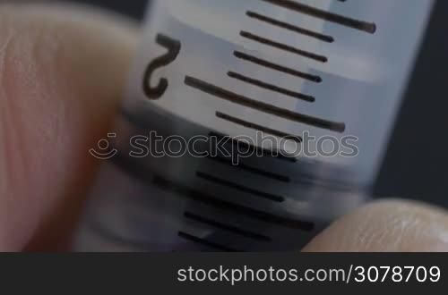 A Macro Close up shot of an Extraction with hypodermic needle