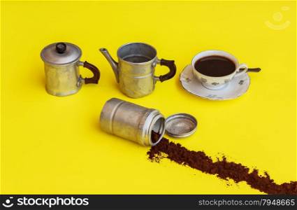 a maker of aluminium removed after filling the cup of coffee with the strip of coffee-powder that comes out from the filter