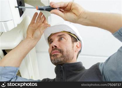 a male air conditioning technician