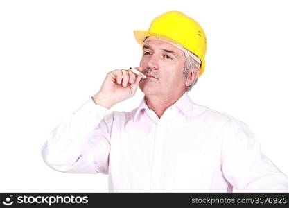 A male architect smoking.