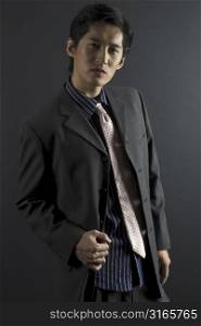A male asian model in a jacket with shirt and tie