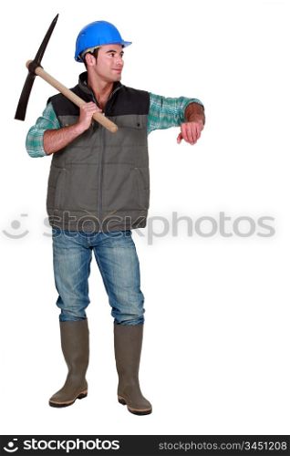 A male construction worker with a pickaxe.