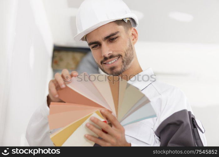 a male designer choosing colours